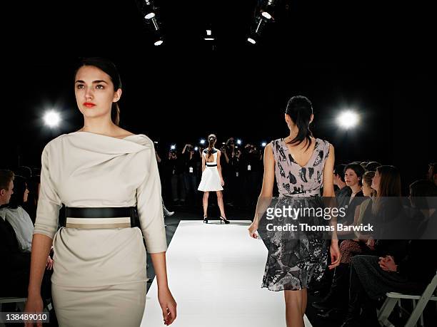 models walking on runway during fashion show - fashion show stock-fotos und bilder