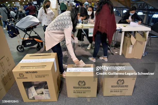 Colombian citizen casts her vote during the Legislative Elections on March 13, 2022 in Bogota, Colombia. Around 38 million of Colombians are entitled...