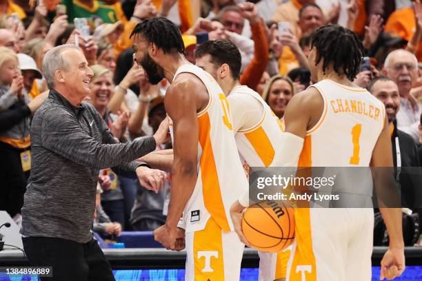 Josiah-Jordan James of the Tennessee Volunteers reacts with head coach Rick Barnes in the second half of the game against the Texas A&M Aggies in the...