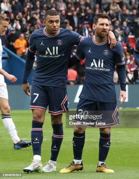 Kylian Mbappe of Paris Saint-Germain celebrate his goal with Lionel Messi during the Ligue 1 Uber Eats match between Paris Saint-Germain and...