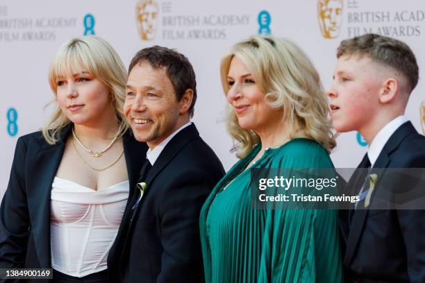 Hannah Walters and Stephen Graham pose with children at the EE British Academy Film Awards 2022 at Royal Albert Hall on March 13, 2022 in London,...