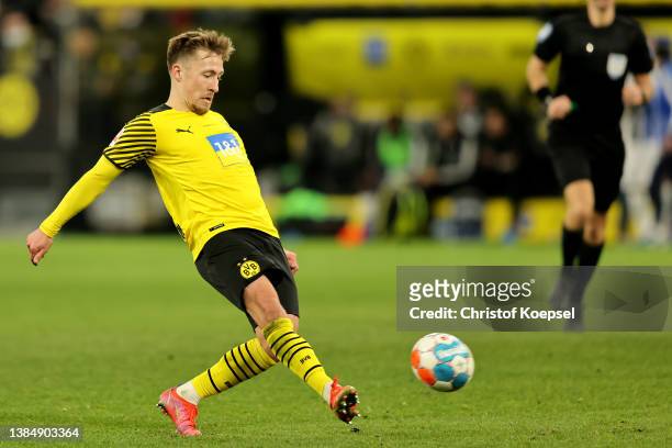Felix Passlack kicks the ball during the Bundesliga match between Borussia Dortmund and DSC Arminia Bielefeld at Signal Iduna Park on March 13, 2022...