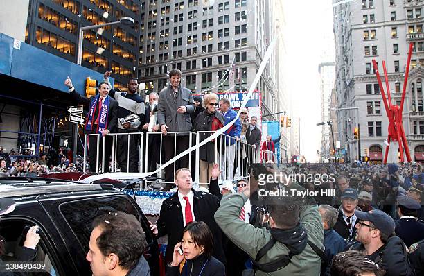 Governor Andrew Cuomo, defensive end Justin Tuck, mayor Michael Bloomberg, quarterback Eli Manning and New York Giants matriarch Ann Mara ride in the...