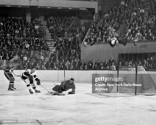 Rangers vs Detroit Andy Bathgate drew two-minute penalty for hooking Val Fonteyne, but it did help Gump Worsley smother Wing's try after goalie...