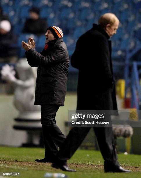 Blackpool manager Ian Holloway celebrates their second goal next to Sheffield Wednesday manager Gary Megson during the FA Cup Fourth Round Replay...