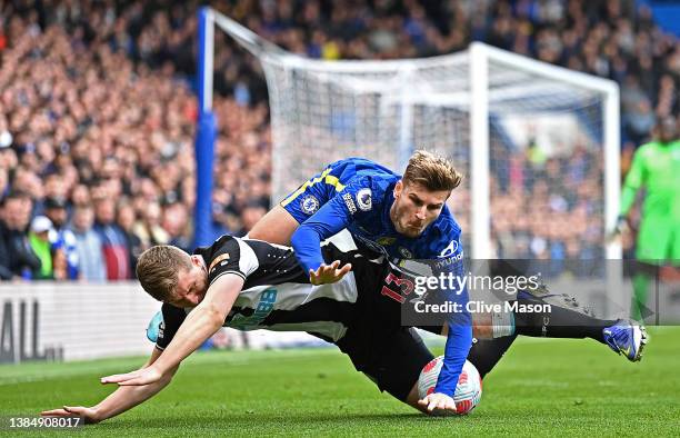 Matt Targett of Newcastle United is challenged by Timo Werner of Chelsea during the Premier League match between Chelsea and Newcastle United at...