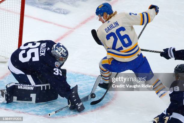 Petr Mrazek of the Toronto Maple Leafs blocks a shot by Rasmus Dahlin of the Buffalo Sabres in the second period during the Heritage Classic at Tim...