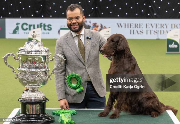 Flat-coated retriever named Baxer is crowned as Best in Show at Crufts Dog Show at National Exhibition Centre on March 13, 2022 in Birmingham,...