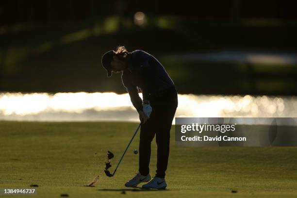 Tommy Fleetwood of England plays his second shot on the par 4, seventh hole as the sun goes down during completion of the weather delayed third round...