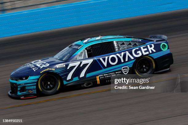 Landon Cassill, driver of the Voyager: Crypto for All Chevrolet, drives during the Ruoff Mortgage 500 at Phoenix Raceway on March 13, 2022 in...