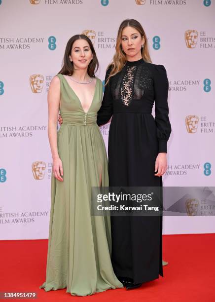 Alana Haim and Este Haim attend the EE British Academy Film Awards 2022 at Royal Albert Hall on March 13, 2022 in London, England.