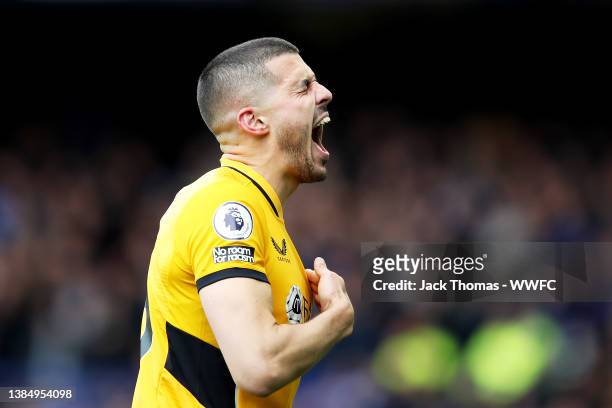 Conor Coady of Wolverhampton Wanderers celebrates after scoring his team's first goal during the Premier League match between Everton and...