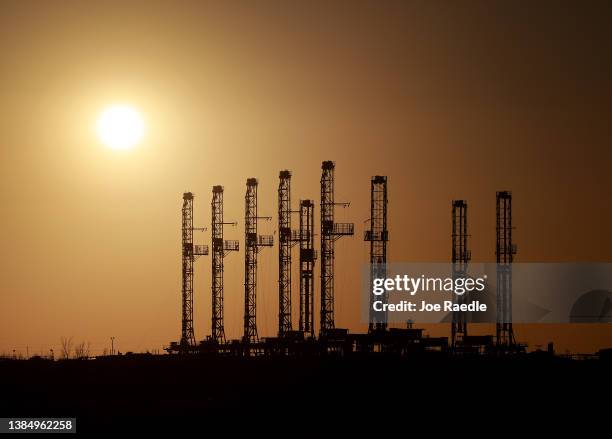 Drilling rigs sit unused on a companies lot located in the Permian Basin area on March 13, 2022 in Odessa, Texas. United States President Joe Biden...