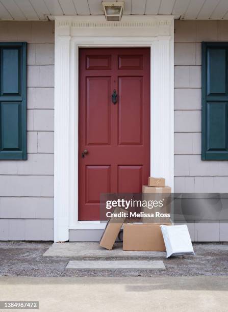 packages delivered to front door - front door stock pictures, royalty-free photos & images