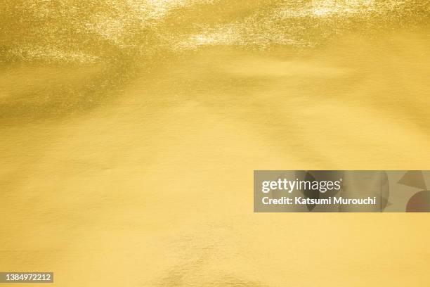 metalic gold foil paper texture background - gold foil stock pictures, royalty-free photos & images