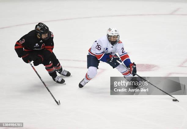 Kendall Coyne Schofield of Team United States skates with the puck as Jocelyne Larocque of Team Canada defends in overtime during the Rivalry Rematch...