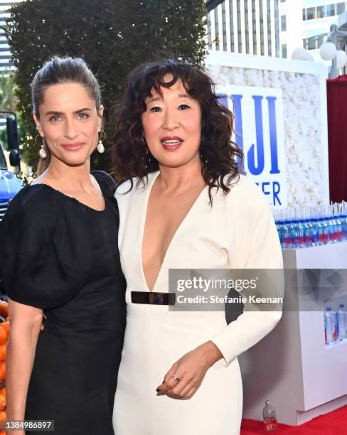 Amanda Peet and Sandra Oh with FIJI Water at the 27th Annual Critics' Choice Awards on March 13, 2022 in Los Angeles, California.