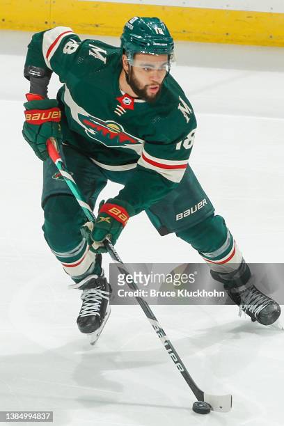 Jordan Greenway of the Minnesota Wild skates with the puck against the New York Rangers during the game at the Xcel Energy Center on March 8, 2022 in...