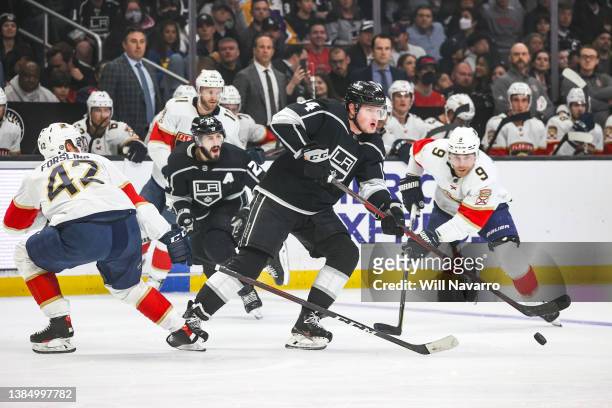Arthur Kaliyev of the Los Angeles Kings skates with the puck during the first period against the Florida Panthers at Crypto.com Arena on March 13,...