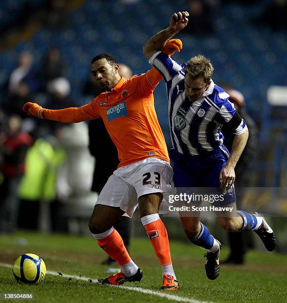 Matt Phillips of Blackpool in action with Chris Sedgwick of Sheffield Wednesday during the FA Cup Fourth Round Replay between Sheffield Wednesday and...