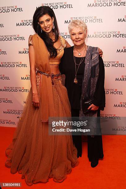 Tena Desae and Dame Judi Dench attend the world premiere of 'The Best Exotic Marigold Hotel' at The Curzon Mayfair on February 7, 2012 in London,...