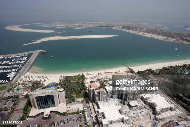 General view dated 20 June 2007 shows high-rise buildings lining the trunk of a great artificial island shaped like a palm tree off the coast of...