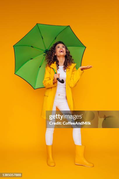 girl with green umbrella - rain model stock pictures, royalty-free photos & images