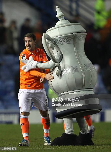 Angel Martinez of Blackpool is congratulated by the FA Cup mascot after victory over Sheffield Wednesday in the FA Cup Fourth Round Replay match...