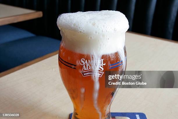 New Samuel Adams beer glass designed for use with their lager is shown at the Sunset Bar in the Allston neighborhood of Boston, Mass. On Wednesday,...