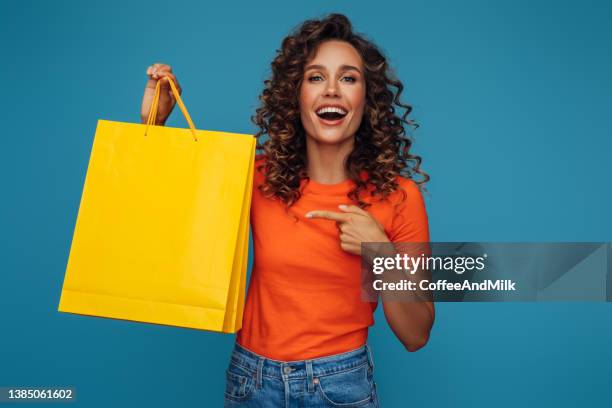 just picked up a few things online - holding shopping bag stock pictures, royalty-free photos & images