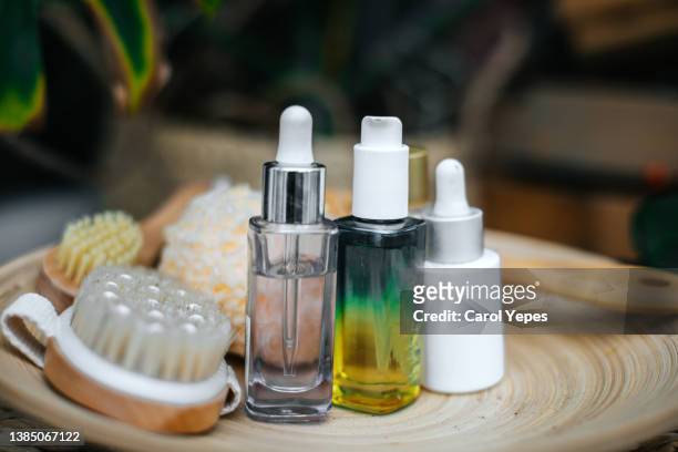 organic spa cosmetic on wooden background - argan oil stockfoto's en -beelden