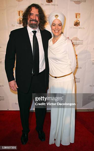 Composer Adam Berry and guest arrive for the 39th Annual Annie Awards at Royce Hall, UCLA on February 4, 2012 in Westwood, California.