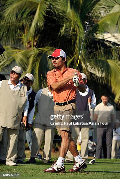 Filipino professional boxer and politician Manny Pacquiao tees off during the Pro-am event ahead of the ICTSI Philippine Open at Wack Wack Golf and...