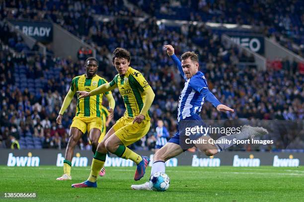 Toni Martinez of FC Porto shoots on goal while he is challenged by Eduardo Quaresma of CD Tondela during the Liga Portugal Bwin match between FC...