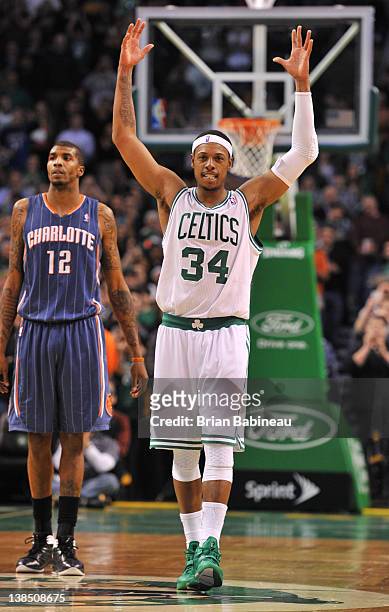 Paul Pierce of the Boston Celtics celebrates passing Larry Bird for second place on the Celtics all time scoring list with 21,792 points during the...