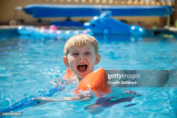 learning to swim - kids pool games stock pictures, royalty-free photos & images