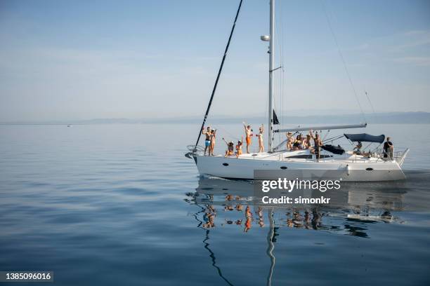 friends having party on boat - boat party stock pictures, royalty-free photos & images