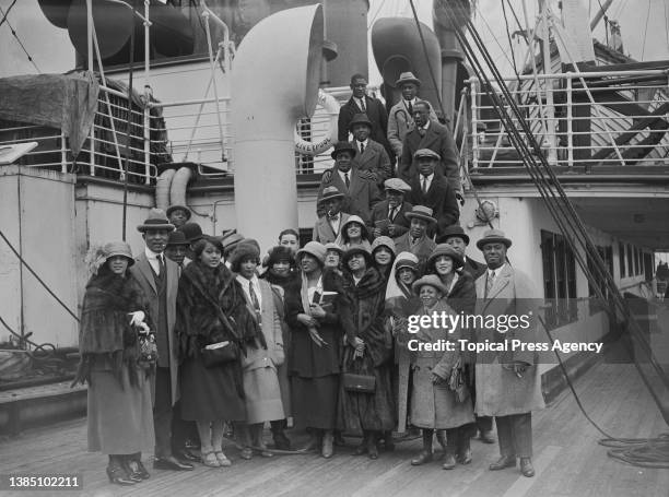 The cast members and orchestra of theater production 'Plantation Revue' on the deck of ship SS Albania, May 1923; not in order, including,...