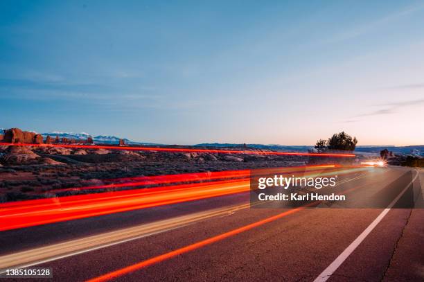 light trails in arches national park, usa - light trail nature stock pictures, royalty-free photos & images