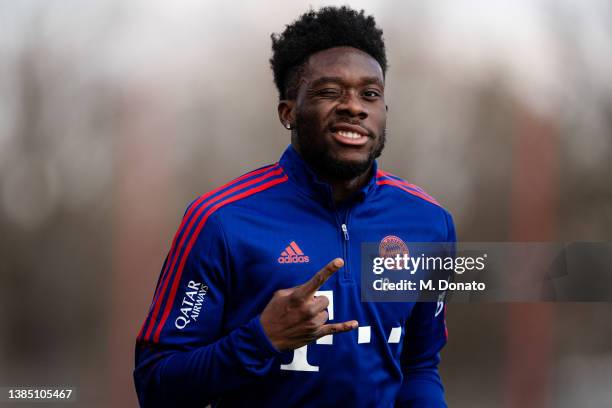 Alphonso Davies of FC Bayern Muenchen winks while working out during a rehabilitation training session at Saebener Strasse training ground on March...