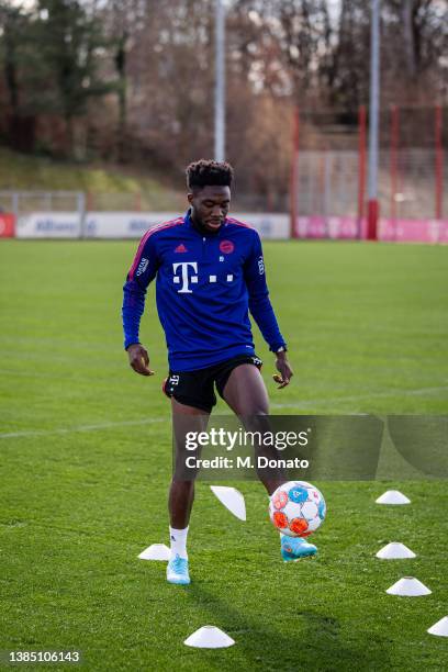 Alphonso Davies of FC Bayern Muenchen controls the ball during a rehabilitation training session at Saebener Strasse training ground on March 14,...