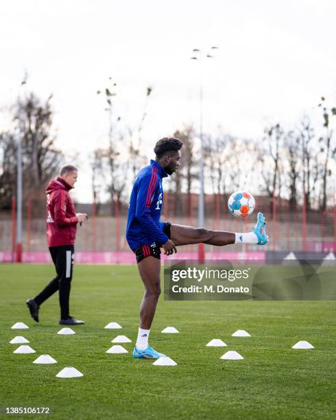 Alphonso Davies of FC Bayern Muenchen controls the ball during a rehabilitation training session at Saebener Strasse training ground on March 14,...