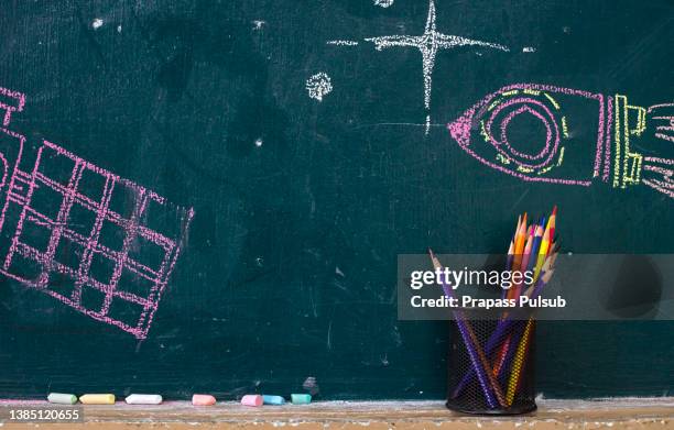 back to school supplies. books and blackboard on wooden background - blackboard 個照片及圖片檔
