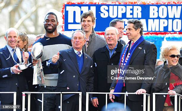 New York Giants player Justin Tuck, New York City Mayor Michael Bloomberg, New York Giants player Eli Manning, New York Giants head coach Tom...