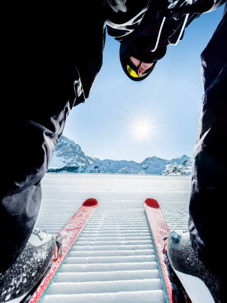 skier ready to descent the fresh ski slope in the french alps. - skiing stock pictures, royalty-free photos & images