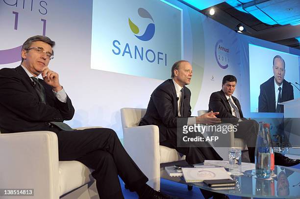 French drug giant Sanofi CEO Christopher Viehbacher , flanked by Elias Zerhouni, member of bthe Executive Committee and global leadership team, and...