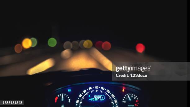 car dashboard. close up image of illuminated car dashboard. - kilometer stock pictures, royalty-free photos & images