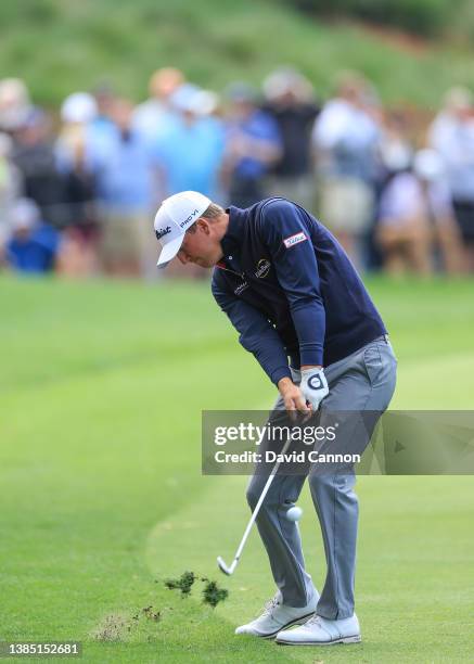 Tom Hoge of The United States plays his second shot on the par 4, 18th hole during completion of the weather delayed third round of THE PLAYERS...