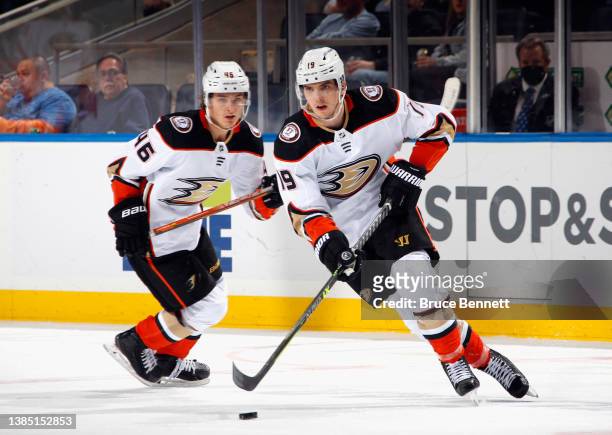 Trevor Zegras and Troy Terry of the Anaheim Ducks skate against the New York Islanders at the UBS Arena on March 13, 2022 in Elmont, New York.