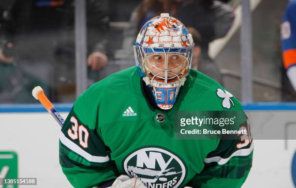 Ilya Sorokin of the New York Islanders wears a special St. Patrick's Day uniform during warm-ups prior to the game against the Anaheim Ducks at the...